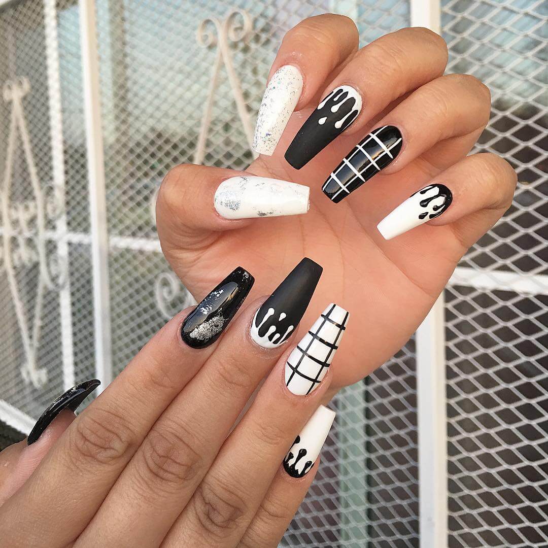 diseño de uñas blancas con negro