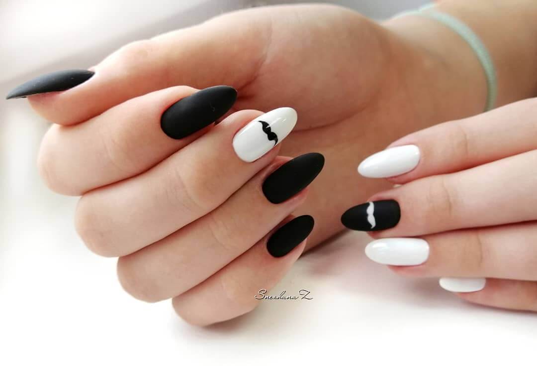 uñas blancas y negras con mustache